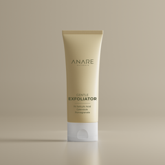Gentle Exfoliator in a sleek tube, displayed in a clear, sand-colored space, highlighting its minimal and refreshing skincare design.