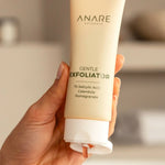 A tube of Gentle Exfoliator being squeezed, releasing a red gel infused with powerful skincare ingredients for smooth and radiant skin.